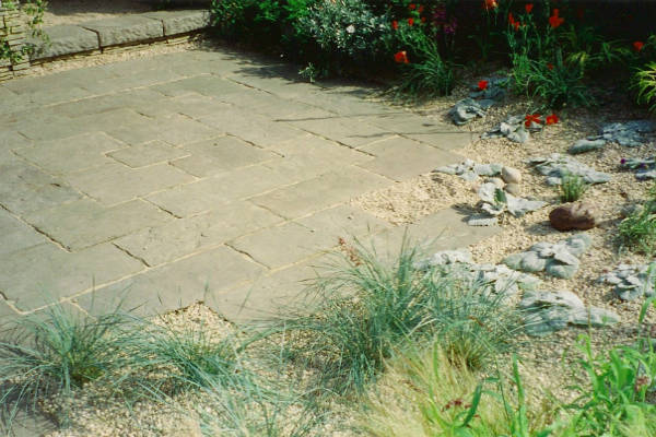 Before: old slabs and gravel