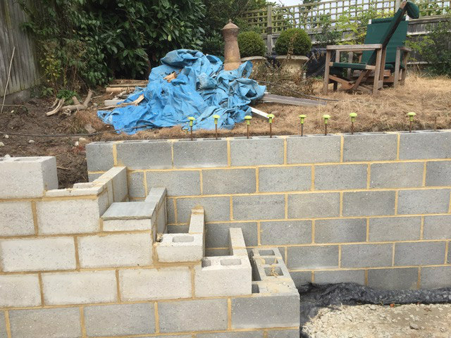 Block steps under construction against a new wall
